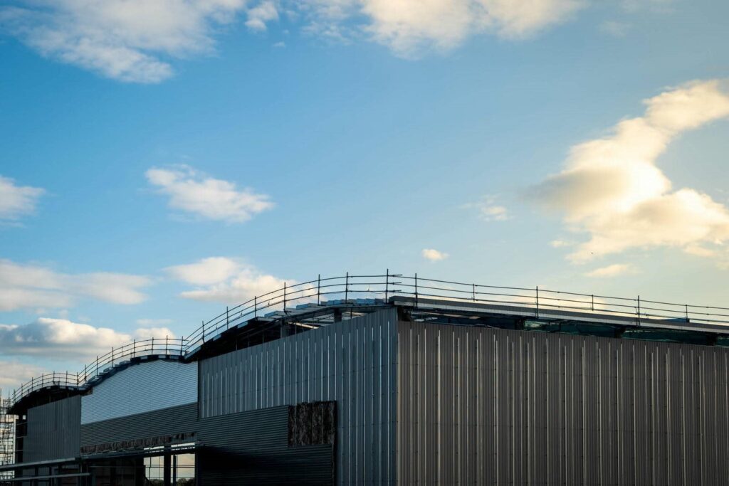 Modern building under construction against sky