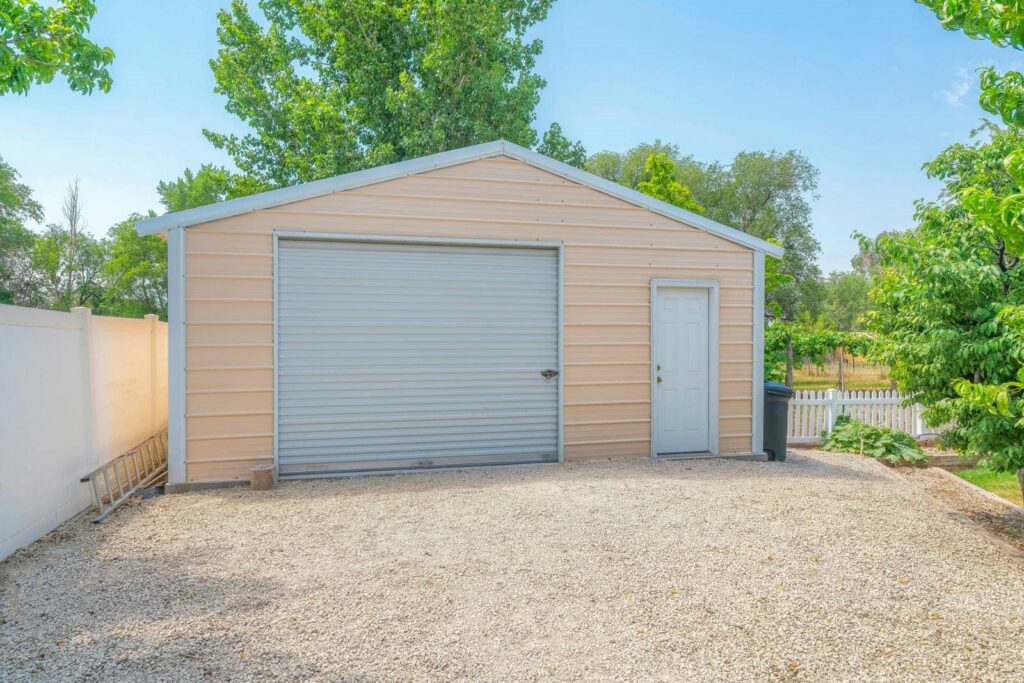 Light-colored steel garage with door