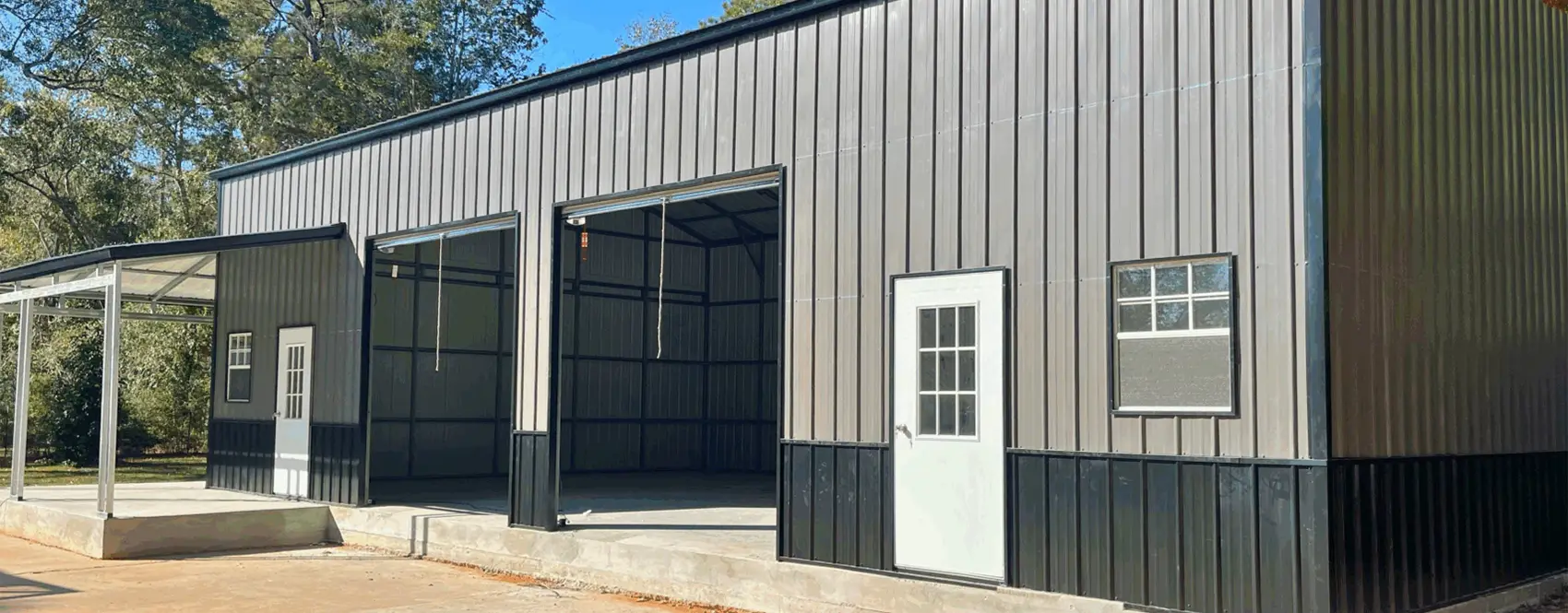 Metal building FAQs hero photo of a gray and black metal building